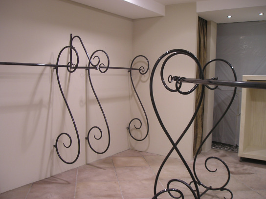 Curled steel clothing stands