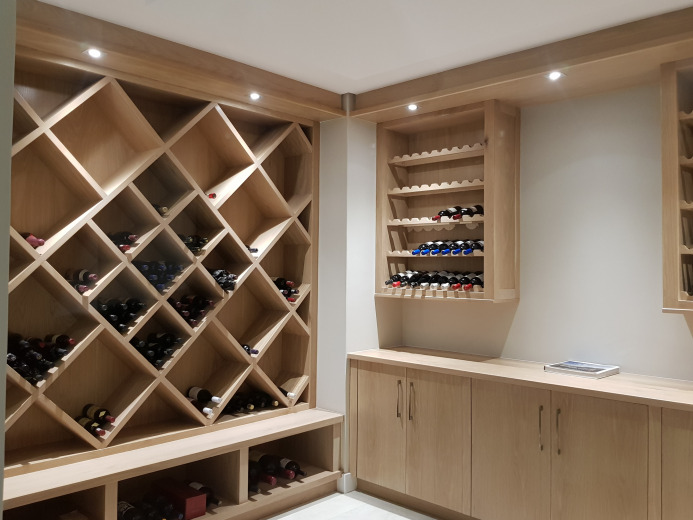 Combination of solid Oak and Oak Veneer wine cellar with solid Oak tops and Veneer Oak doors with Barcelona handles